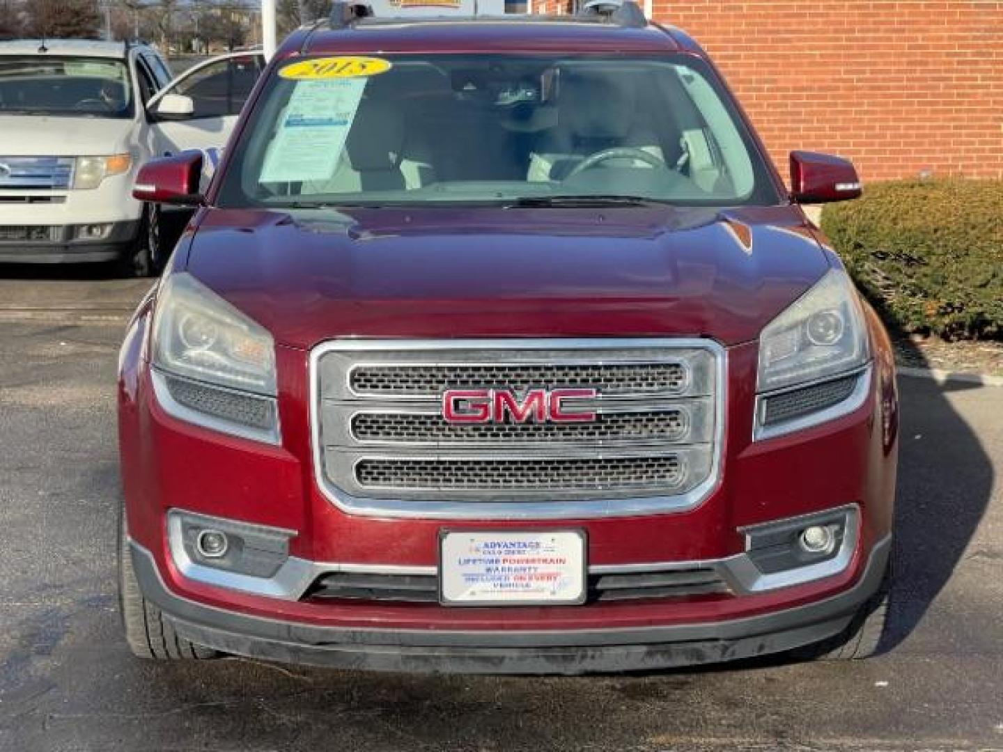 2015 Crimson Red Tincoat GMC Acadia SLT-1 FWD (1GKKRRKD7FJ) with an 3.6L V6 DOHC 24V engine, 6-Speed Automatic transmission, located at 880 E. National Road, Vandalia, OH, 45377, (937) 908-9800, 39.892189, -84.181015 - Photo#2