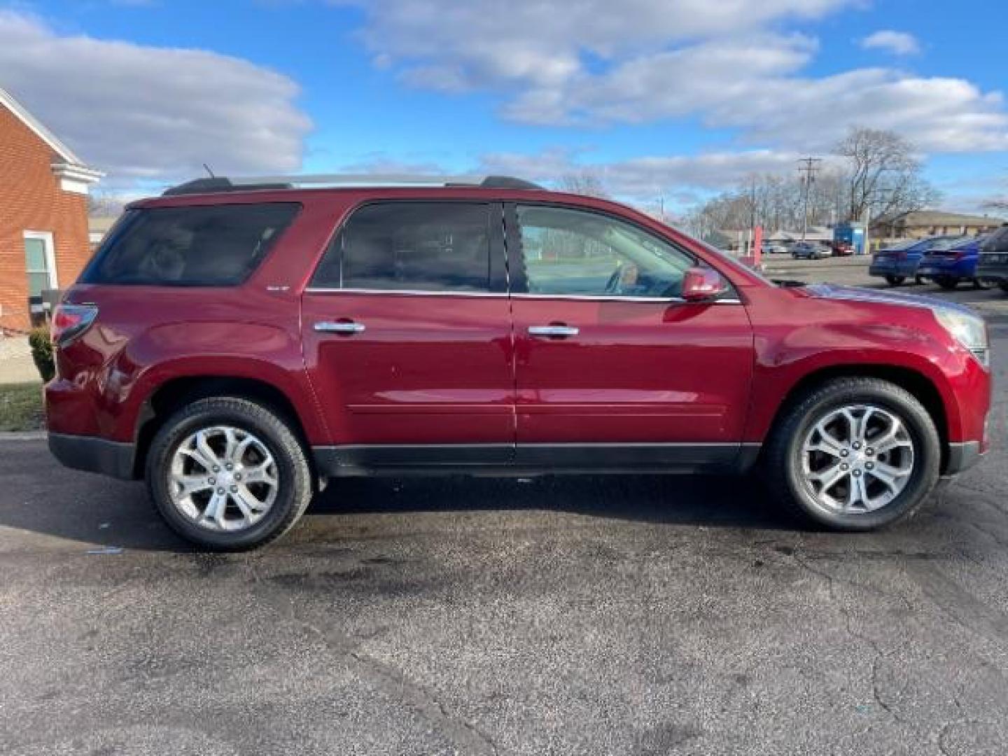 2015 Crimson Red Tincoat GMC Acadia SLT-1 FWD (1GKKRRKD7FJ) with an 3.6L V6 DOHC 24V engine, 6-Speed Automatic transmission, located at 880 E. National Road, Vandalia, OH, 45377, (937) 908-9800, 39.892189, -84.181015 - Photo#4