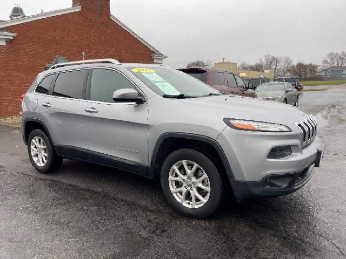 2015 Billet Silver Metallic CC Jeep Cherokee Latitude 4WD (1C4PJMCBXFW) with an 2.4L L4 DOHC 16V engine, 9-Speed Automatic transmission, located at 1184 Kauffman Ave, Fairborn, OH, 45324, (937) 908-9800, 39.807365, -84.029114 - Photo#0