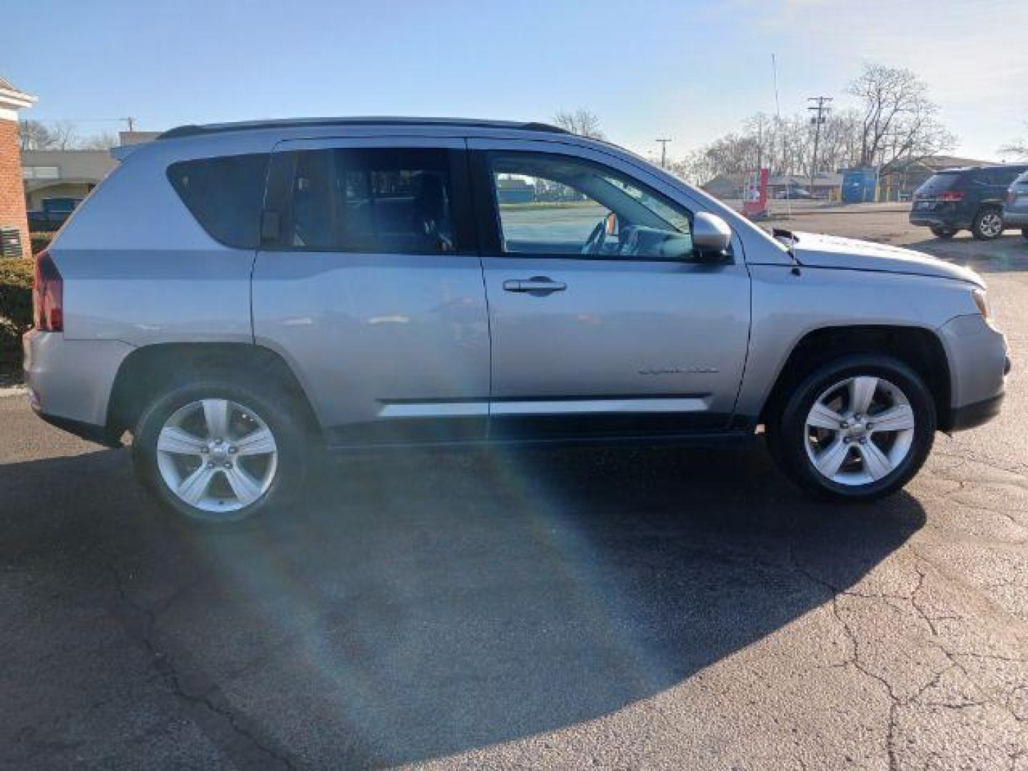 2015 Billet Silver Metallic Clear Coat Jeep Compass Latitude 4WD (1C4NJDEB0FD) with an 2.4L L4 DOHC 16V engine, 6-Speed Automatic transmission, located at 1951 S Dayton Lakeview Rd., New Carlisle, OH, 45344, (937) 908-9800, 39.890999, -84.050255 - Photo#4