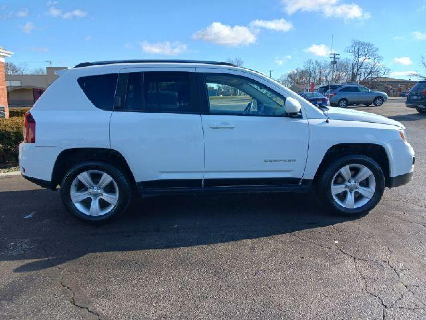 2015 Bright White Clear Coat Jeep Compass Latitude FWD (1C4NJCEA6FD) with an 2.0L L4 DOHC 16V engine, Continuously Variable Transmission transmission, located at 1099 N County Rd 25A, OH, 45373, (937) 908-9800, 40.057079, -84.212883 - Photo#4