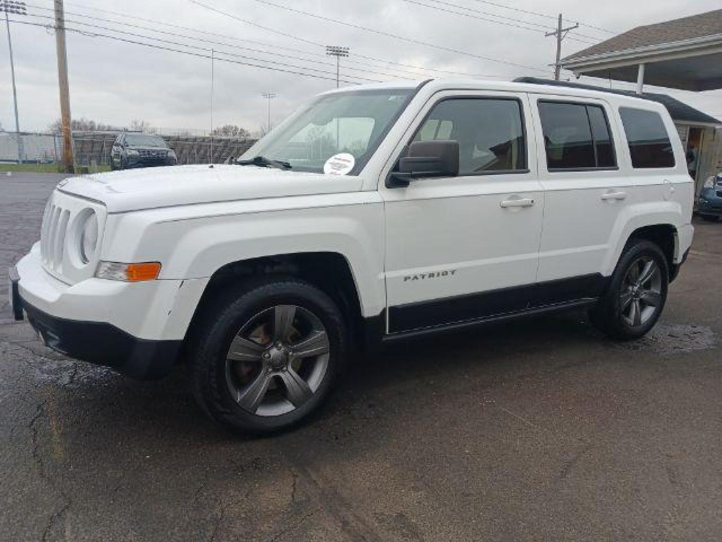 2015 Bright White Clearcoat Jeep Patriot Latitude 2WD (1C4NJPFA8FD) with an 2.0L L4 DOHC 16V engine, located at 880 E. National Road, Vandalia, OH, 45377, (937) 908-9800, 39.892189, -84.181015 - Photo#2