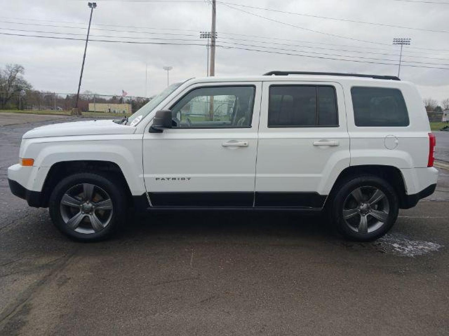 2015 Bright White Clearcoat Jeep Patriot Latitude 2WD (1C4NJPFA8FD) with an 2.0L L4 DOHC 16V engine, located at 880 E. National Road, Vandalia, OH, 45377, (937) 908-9800, 39.892189, -84.181015 - Photo#3