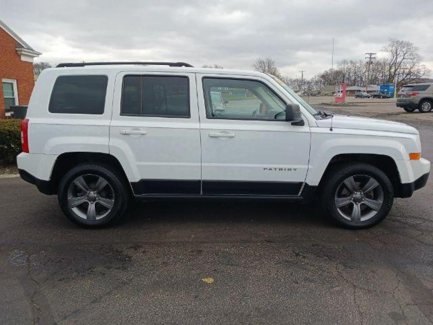 2015 Bright White Clearcoat Jeep Patriot Latitude 2WD (1C4NJPFA8FD) with an 2.0L L4 DOHC 16V engine, located at 880 E. National Road, Vandalia, OH, 45377, (937) 908-9800, 39.892189, -84.181015 - Photo#4