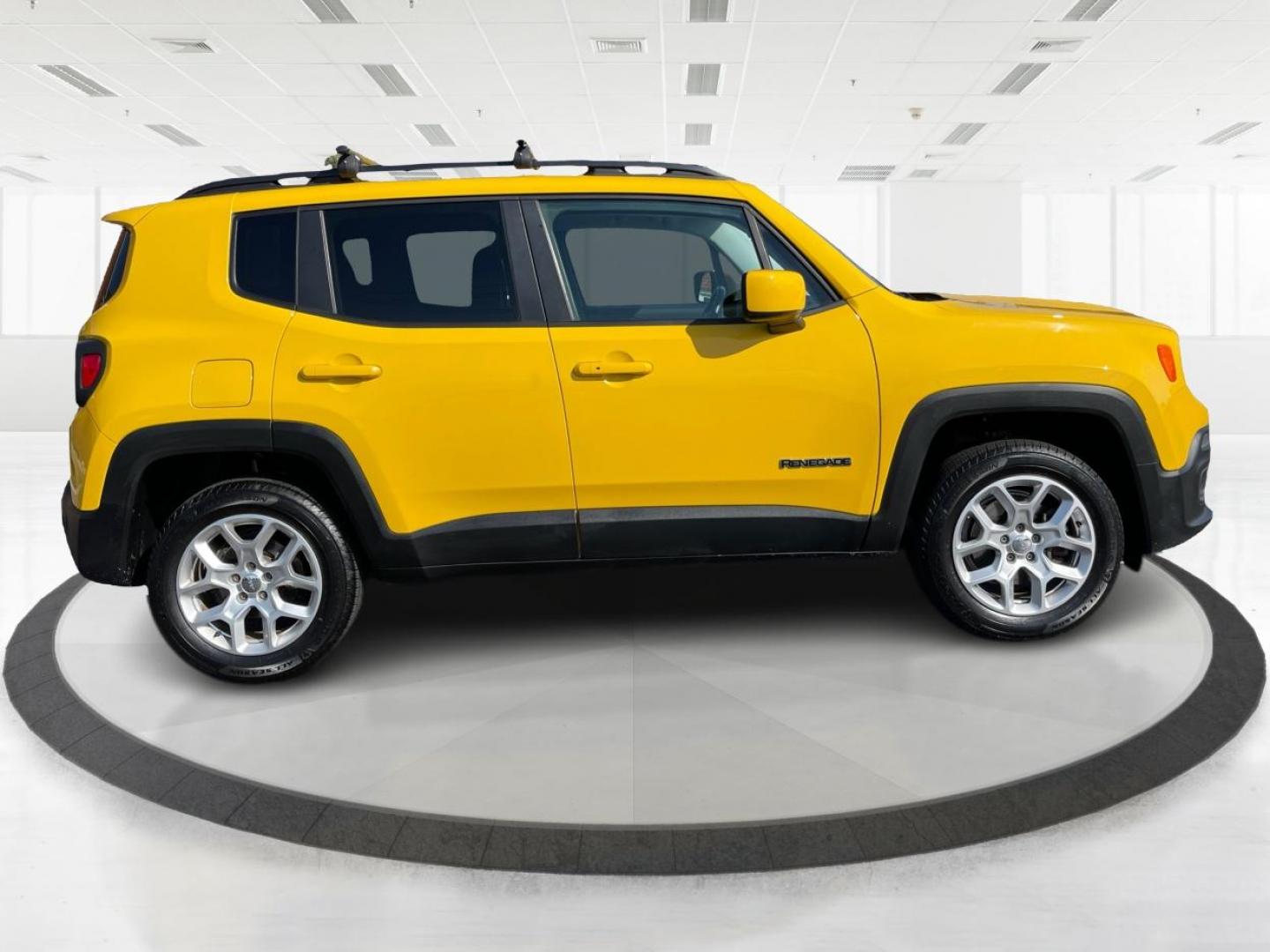 2015 Solar Yellow Jeep Renegade Latitude 4WD (ZACCJBBT3FP) with an 2.4L L4 engine, 6-Speed Manual transmission, located at 1951 S Dayton Lakeview Rd., New Carlisle, OH, 45344, (937) 908-9800, 39.890999, -84.050255 - Photo#1