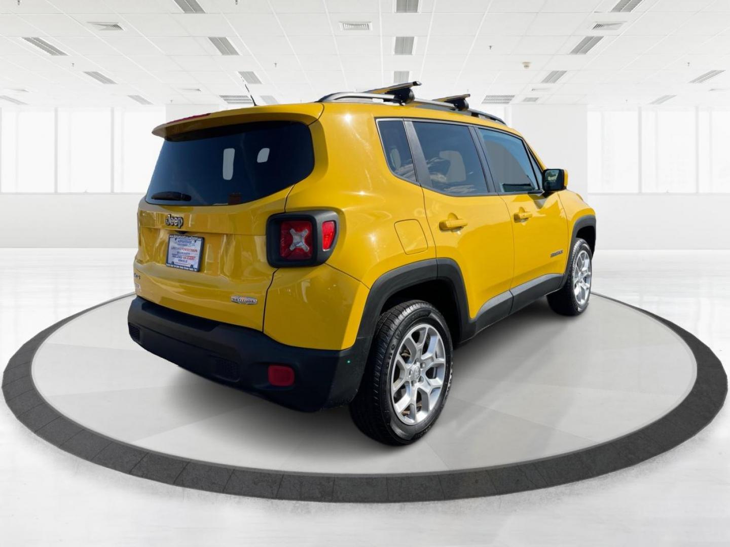 2015 Solar Yellow Jeep Renegade Latitude 4WD (ZACCJBBT3FP) with an 2.4L L4 engine, 6-Speed Manual transmission, located at 1951 S Dayton Lakeview Rd., New Carlisle, OH, 45344, (937) 908-9800, 39.890999, -84.050255 - Photo#2