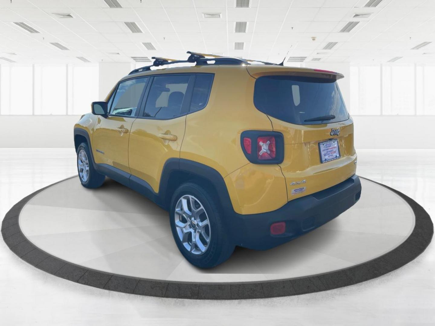 2015 Solar Yellow Jeep Renegade Latitude 4WD (ZACCJBBT3FP) with an 2.4L L4 engine, 6-Speed Manual transmission, located at 1951 S Dayton Lakeview Rd., New Carlisle, OH, 45344, (937) 908-9800, 39.890999, -84.050255 - Photo#4