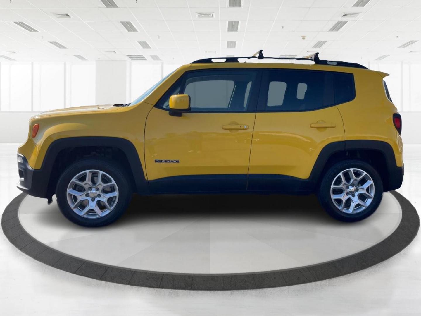 2015 Solar Yellow Jeep Renegade Latitude 4WD (ZACCJBBT3FP) with an 2.4L L4 engine, 6-Speed Manual transmission, located at 1951 S Dayton Lakeview Rd., New Carlisle, OH, 45344, (937) 908-9800, 39.890999, -84.050255 - Photo#5