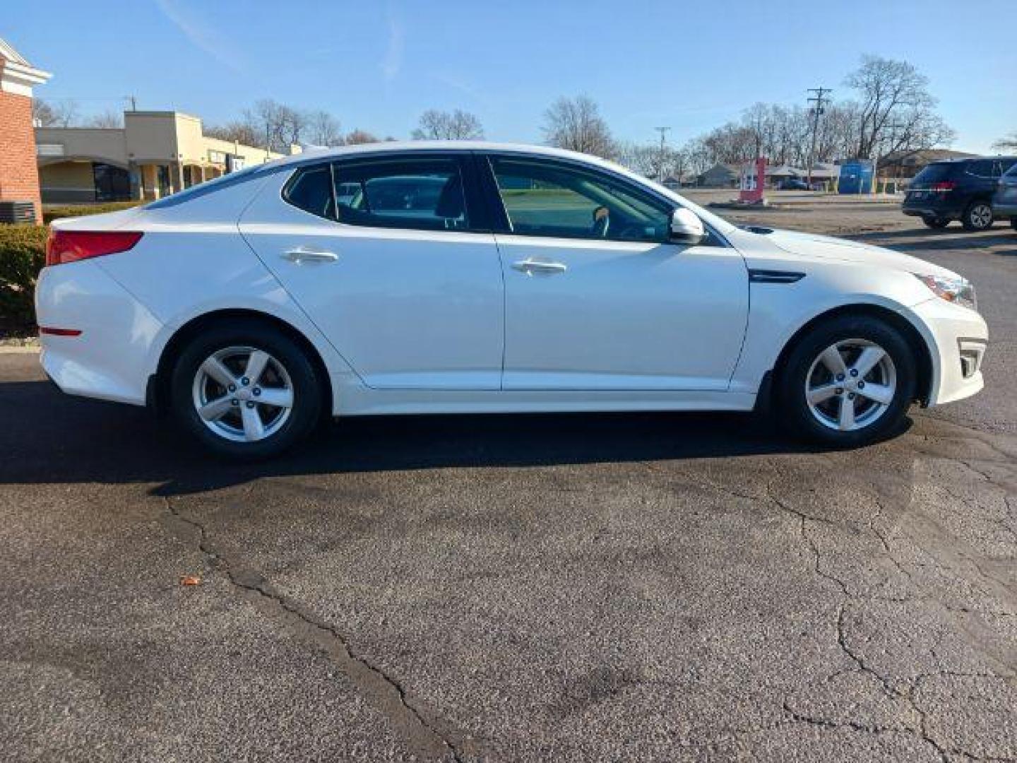 2015 Snow White Pearl Kia Optima LX (KNAGM4A71F5) with an 2.4L L4 DOHC 16V engine, 6-Speed Automatic transmission, located at 880 E. National Road, Vandalia, OH, 45377, (937) 908-9800, 39.892189, -84.181015 - Photo#4