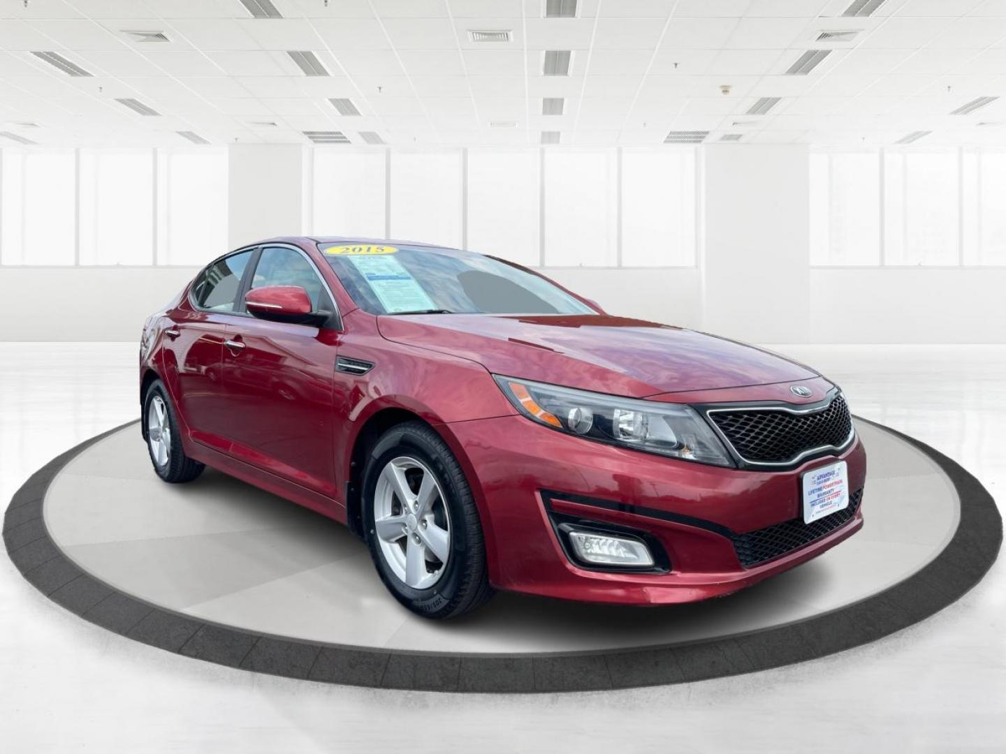 2015 Remington Red Metallic Kia Optima LX (5XXGM4A79FG) with an 2.4L L4 DOHC 16V engine, 6-Speed Automatic transmission, located at 880 E. National Road, Vandalia, OH, 45377, (937) 908-9800, 39.892189, -84.181015 - Photo#0