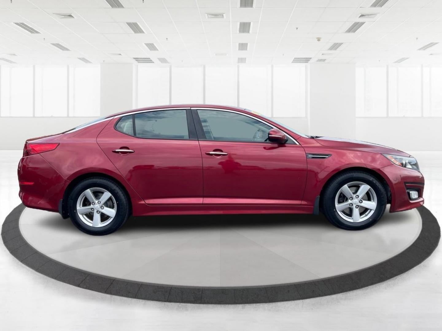 2015 Remington Red Metallic Kia Optima LX (5XXGM4A79FG) with an 2.4L L4 DOHC 16V engine, 6-Speed Automatic transmission, located at 880 E. National Road, Vandalia, OH, 45377, (937) 908-9800, 39.892189, -84.181015 - Photo#1