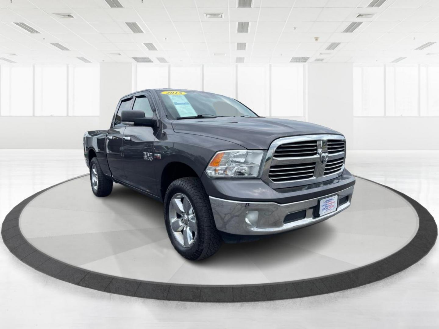 2015 Gray RAM 1500 SLT Quad Cab 4WD (1C6RR7GT3FS) with an 5.7L V8 OHV 16V engine, 8-Speed Automatic transmission, located at 1099 N County Rd 25A, OH, 45373, (937) 908-9800, 40.057079, -84.212883 - Photo#0