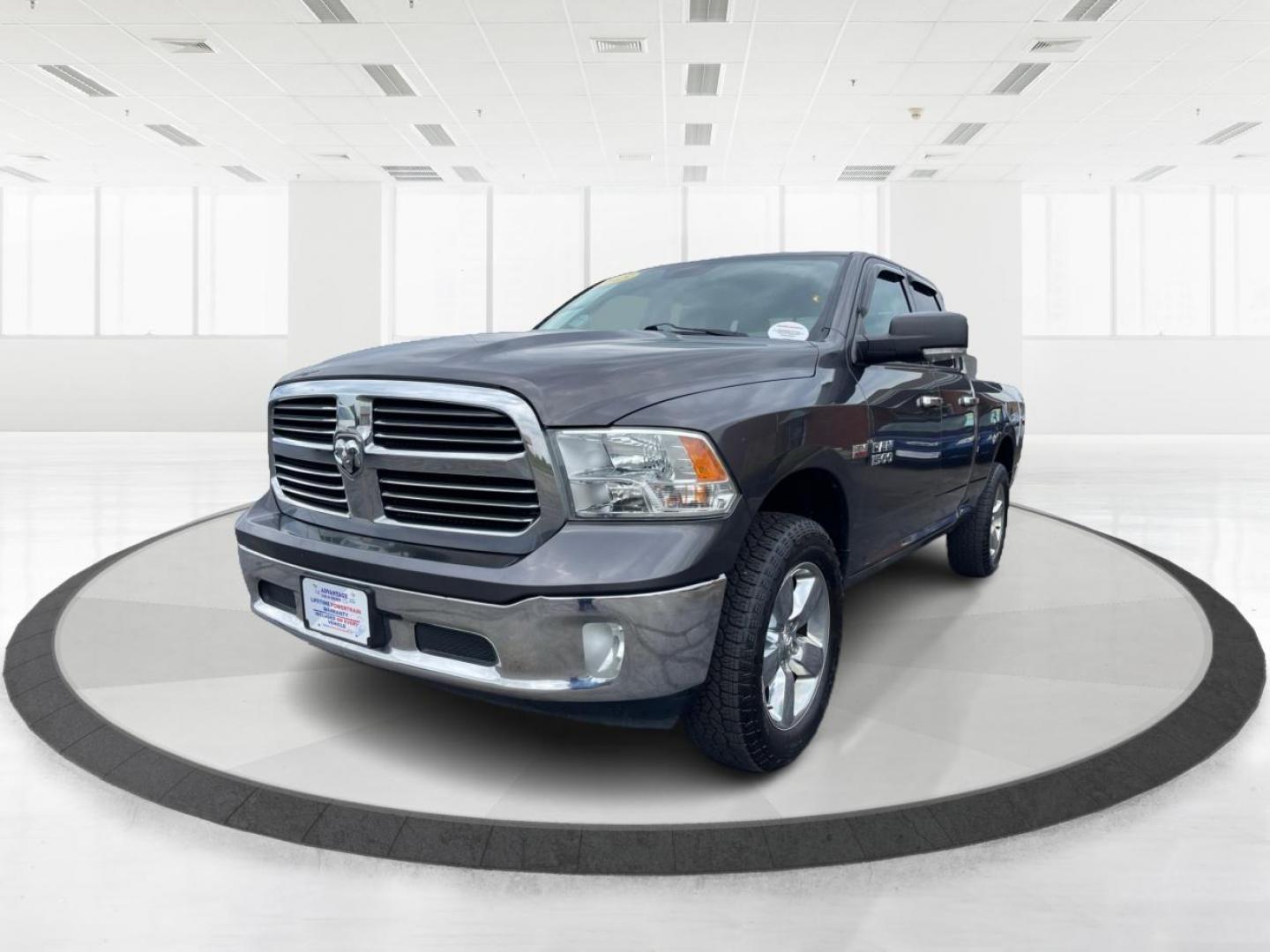 2015 Gray RAM 1500 SLT Quad Cab 4WD (1C6RR7GT3FS) with an 5.7L V8 OHV 16V engine, 8-Speed Automatic transmission, located at 1099 N County Rd 25A, OH, 45373, (937) 908-9800, 40.057079, -84.212883 - Photo#7