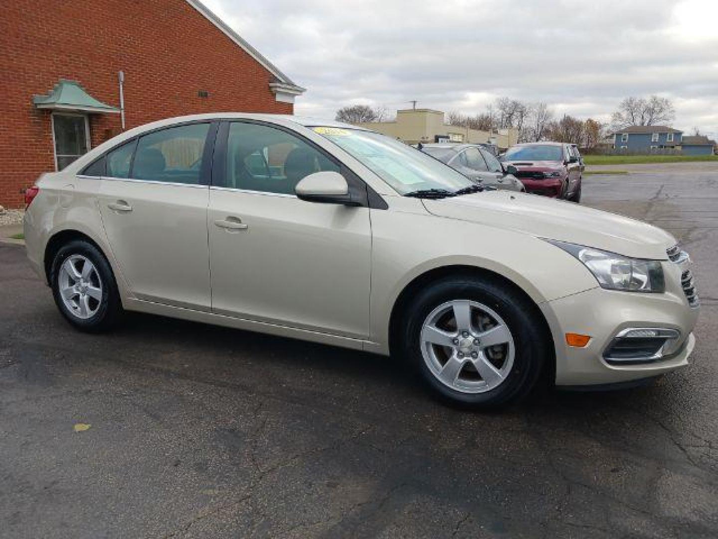 2016 Gold Chevrolet Cruze Limited 1LT Auto (1G1PE5SB0G7) with an 1.4L L4 DOHC 16V TURBO engine, 6-Speed Automatic transmission, located at 1099 N County Rd 25A, OH, 45373, (937) 908-9800, 40.057079, -84.212883 - Photo#0