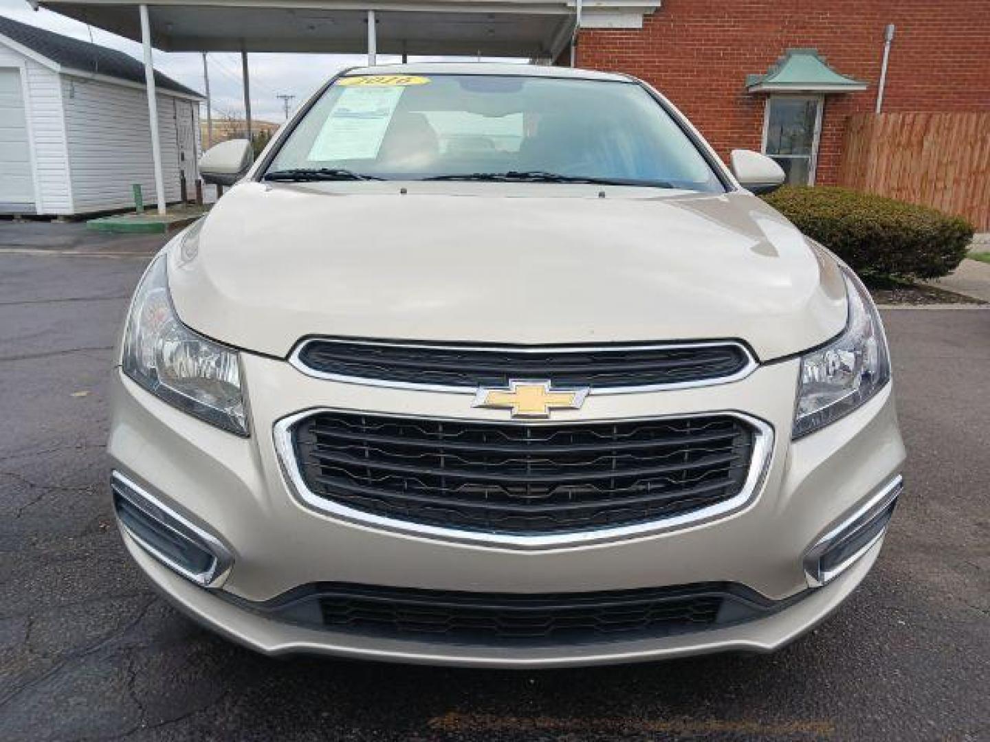 2016 Gold Chevrolet Cruze Limited 1LT Auto (1G1PE5SB0G7) with an 1.4L L4 DOHC 16V TURBO engine, 6-Speed Automatic transmission, located at 1099 N County Rd 25A, OH, 45373, (937) 908-9800, 40.057079, -84.212883 - Photo#1