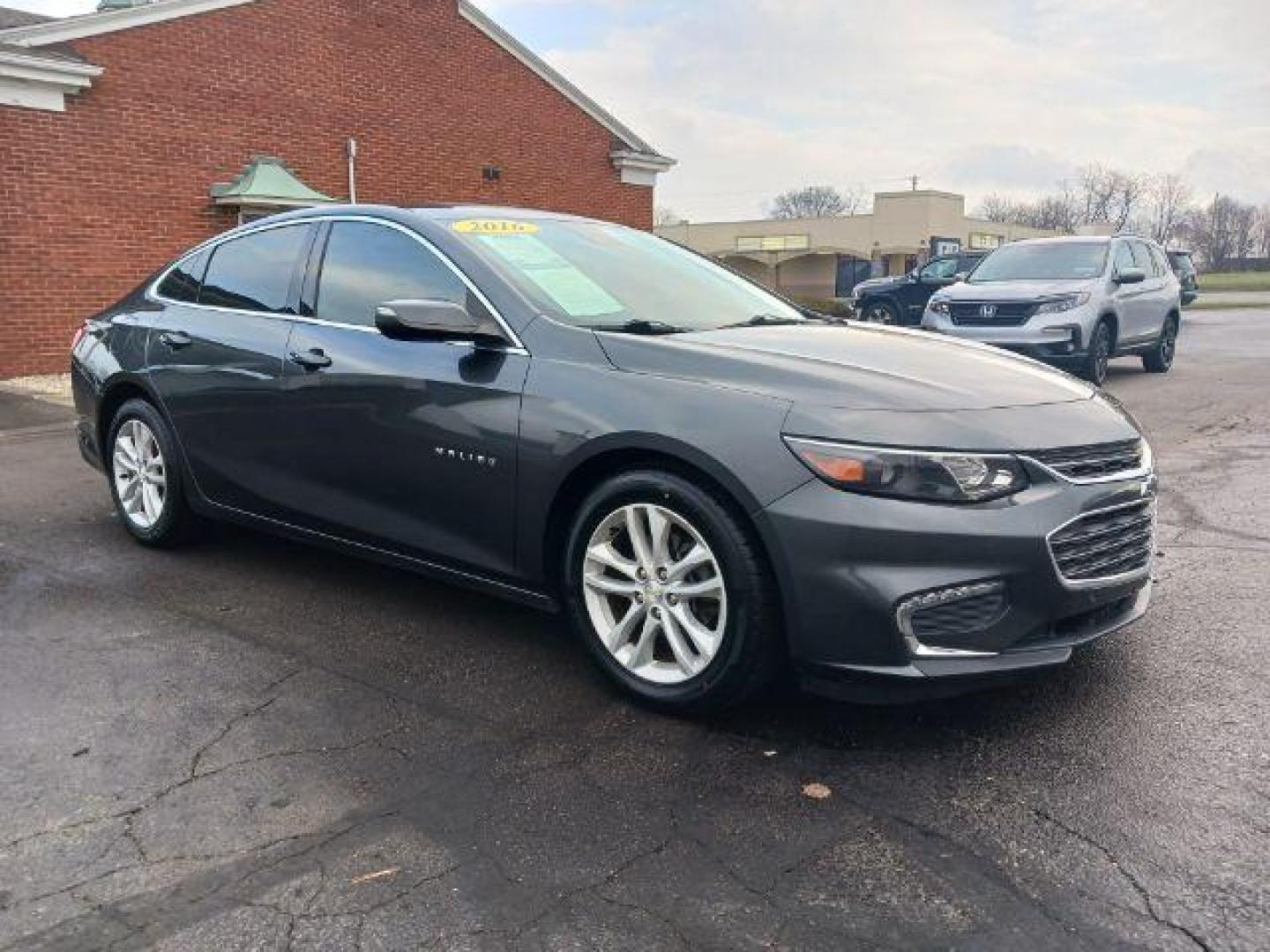 2016 Mosaic Black Metallic Chevrolet Malibu 1LT (1G1ZE5ST7GF) with an 1.5L L4 DOHC 16V engine, 6-Speed Automatic transmission, located at 4508 South Dixie Dr, Moraine, OH, 45439, (937) 908-9800, 39.690136, -84.216438 - Photo#0