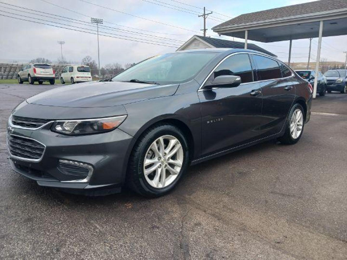 2016 Mosaic Black Metallic Chevrolet Malibu 1LT (1G1ZE5ST7GF) with an 1.5L L4 DOHC 16V engine, 6-Speed Automatic transmission, located at 4508 South Dixie Dr, Moraine, OH, 45439, (937) 908-9800, 39.690136, -84.216438 - Photo#2