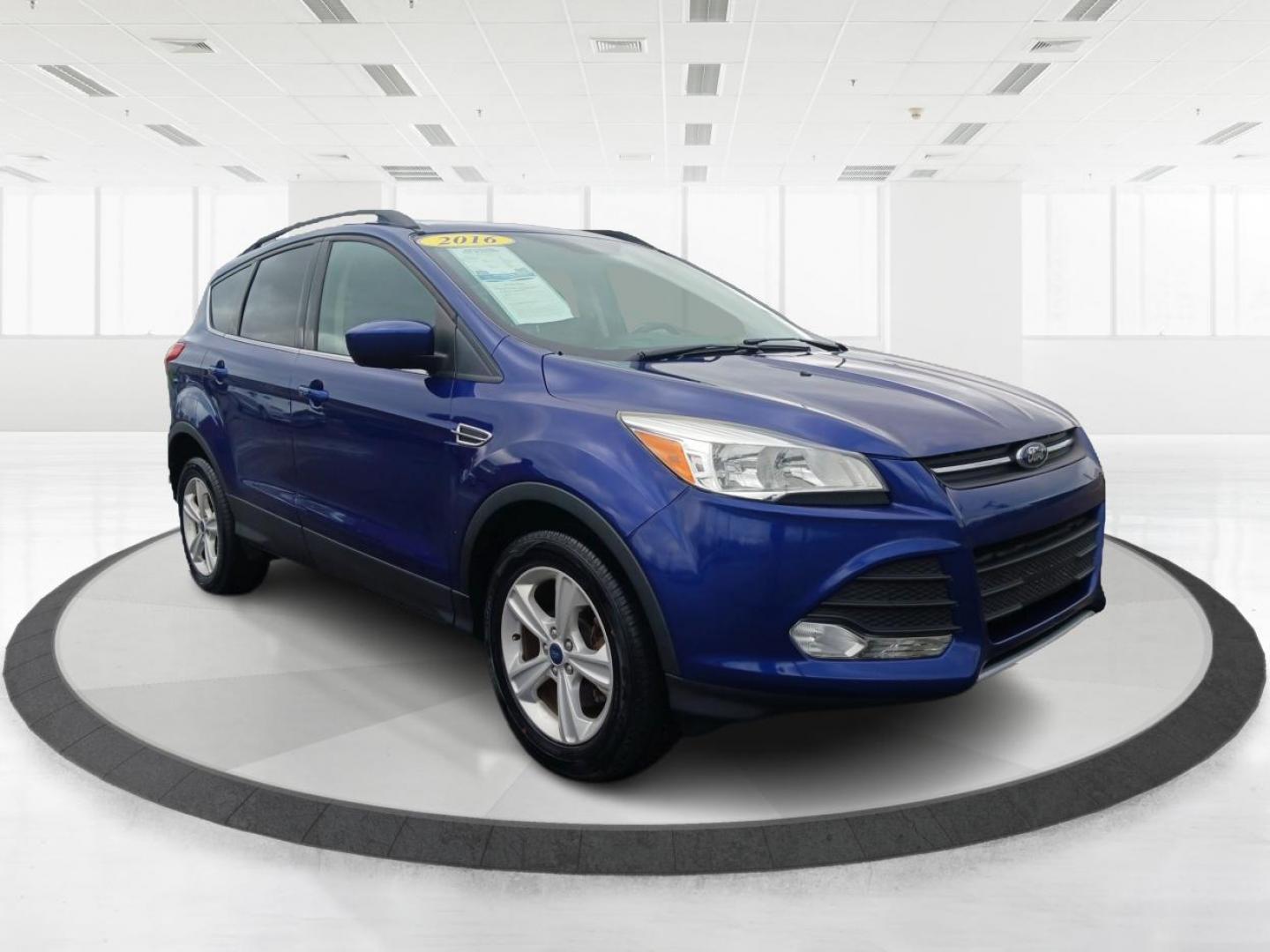 2016 Deep Impact Blue Metallic Ford Escape SE 4WD (1FMCU9G9XGU) with an 2.0L L4 DOHC 16V engine, 6-Speed Automatic transmission, located at 880 E. National Road, Vandalia, OH, 45377, (937) 908-9800, 39.892189, -84.181015 - Photo#0