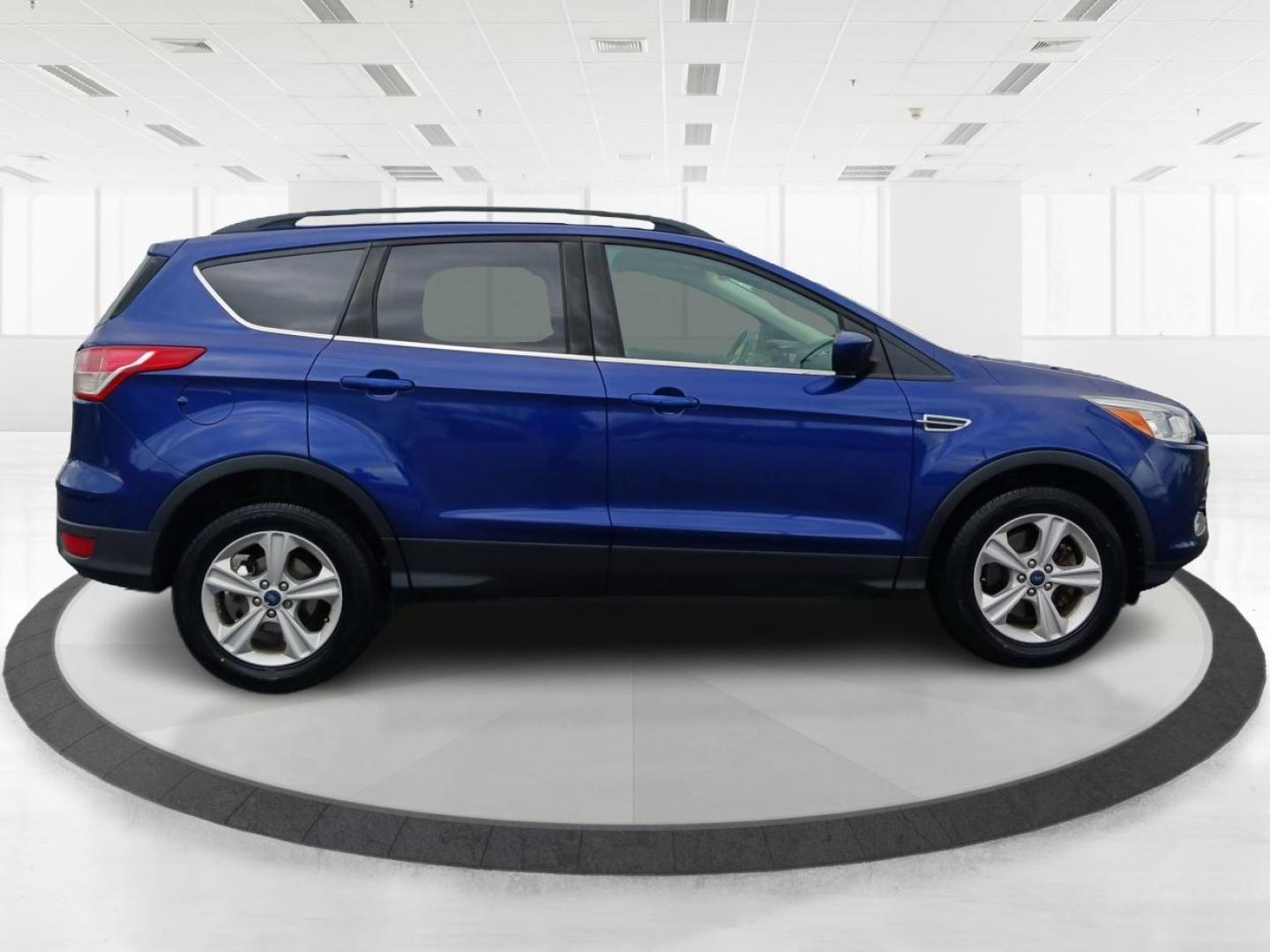 2016 Deep Impact Blue Metallic Ford Escape SE 4WD (1FMCU9G9XGU) with an 2.0L L4 DOHC 16V engine, 6-Speed Automatic transmission, located at 880 E. National Road, Vandalia, OH, 45377, (937) 908-9800, 39.892189, -84.181015 - Photo#1