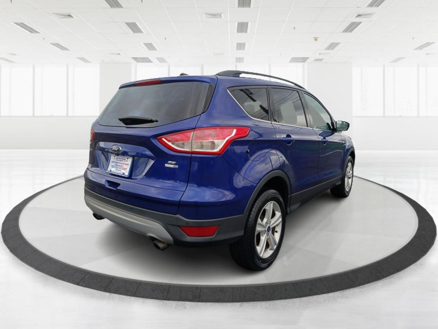 2016 Deep Impact Blue Metallic Ford Escape SE 4WD (1FMCU9G9XGU) with an 2.0L L4 DOHC 16V engine, 6-Speed Automatic transmission, located at 880 E. National Road, Vandalia, OH, 45377, (937) 908-9800, 39.892189, -84.181015 - Photo#2