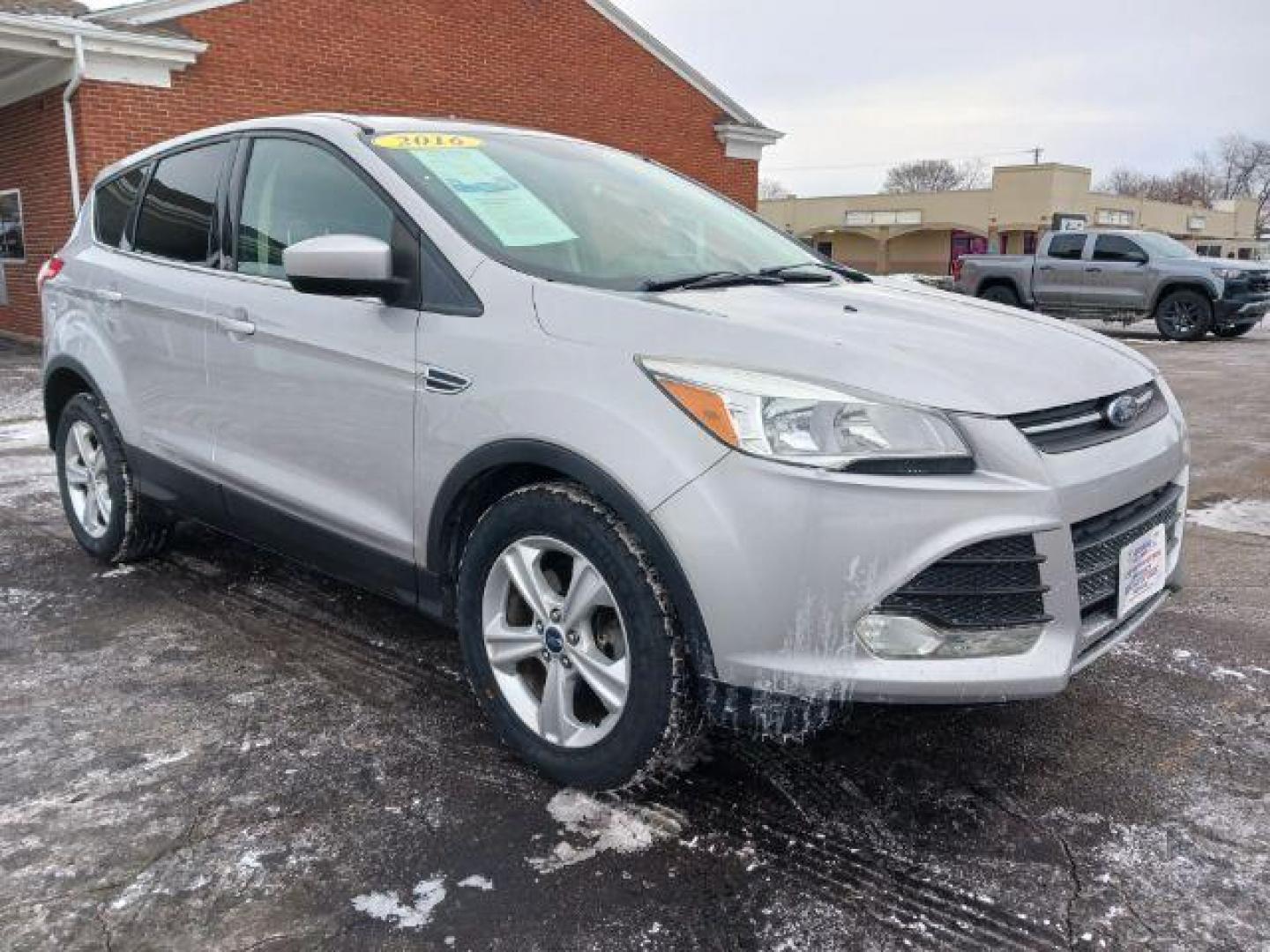 2016 Ingot Silver Metallic Ford Escape SE 4WD (1FMCU9G96GU) with an 2.0L L4 DOHC 16V engine, 6-Speed Automatic transmission, located at 4508 South Dixie Dr, Moraine, OH, 45439, (937) 908-9800, 39.690136, -84.216438 - Photo#0