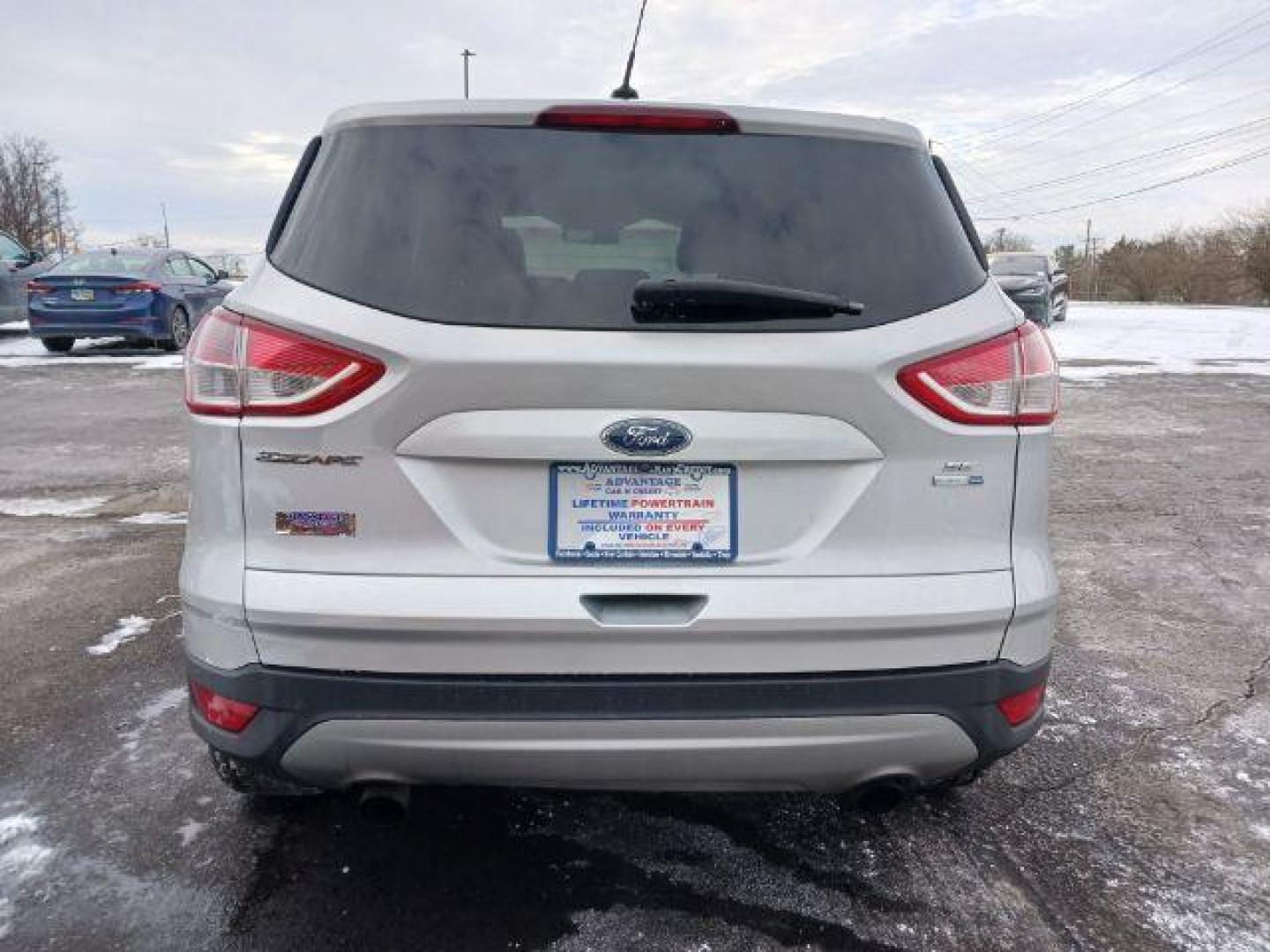 2016 Ingot Silver Metallic Ford Escape SE 4WD (1FMCU9G96GU) with an 2.0L L4 DOHC 16V engine, 6-Speed Automatic transmission, located at 4508 South Dixie Dr, Moraine, OH, 45439, (937) 908-9800, 39.690136, -84.216438 - Photo#5