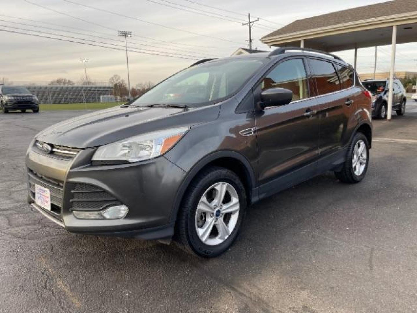 2016 Magnetic Metallic Ford Escape SE 4WD (1FMCU9G99GU) with an 2.0L L4 DOHC 16V engine, 6-Speed Automatic transmission, located at 1230 East Main St, Xenia, OH, 45385, (937) 908-9800, 39.687321, -83.910294 - Photo#1