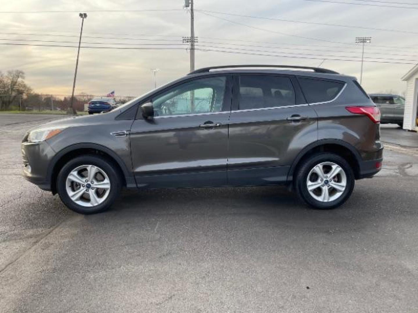 2016 Magnetic Metallic Ford Escape SE 4WD (1FMCU9G99GU) with an 2.0L L4 DOHC 16V engine, 6-Speed Automatic transmission, located at 1230 East Main St, Xenia, OH, 45385, (937) 908-9800, 39.687321, -83.910294 - Photo#2