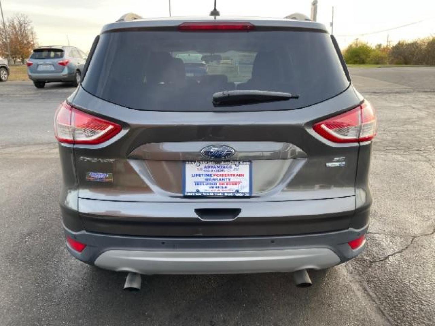 2016 Magnetic Metallic Ford Escape SE 4WD (1FMCU9G99GU) with an 2.0L L4 DOHC 16V engine, 6-Speed Automatic transmission, located at 1230 East Main St, Xenia, OH, 45385, (937) 908-9800, 39.687321, -83.910294 - Photo#4