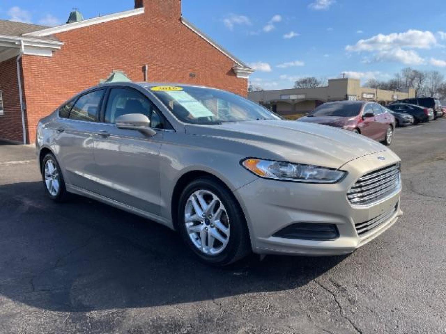 2016 Brown Ford Fusion SE (3FA6P0H70GR) with an 2.5L L4 DOHC 16V engine, 6-Speed Automatic transmission, located at 1951 S Dayton Lakeview Rd., New Carlisle, OH, 45344, (937) 908-9800, 39.890999, -84.050255 - Photo#0