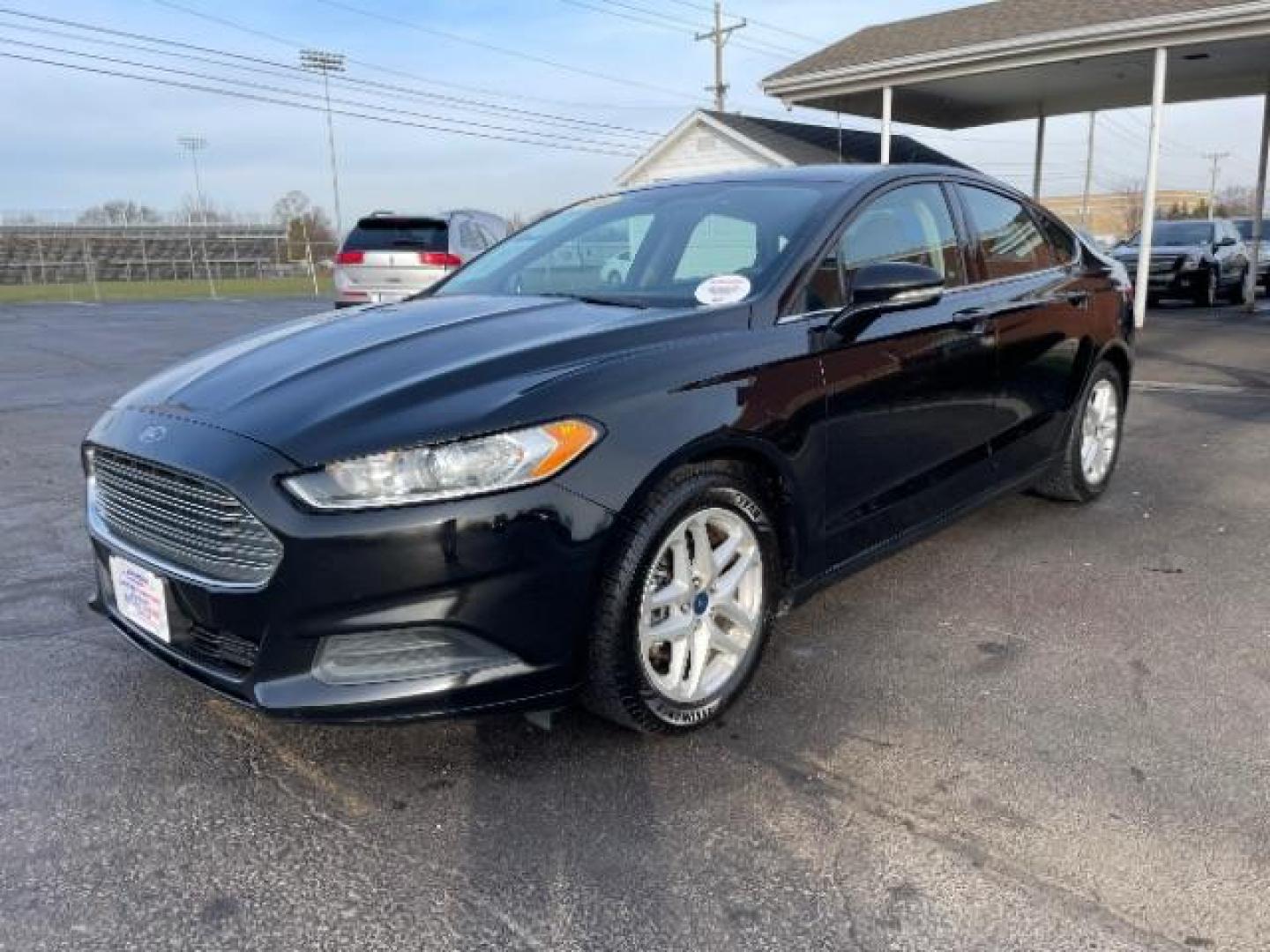 2016 Shadow Black Ford Fusion SE (3FA6P0H72GR) with an 2.5L L4 DOHC 16V engine, 6-Speed Automatic transmission, located at 1230 East Main St, Xenia, OH, 45385, (937) 908-9800, 39.687321, -83.910294 - Photo#1