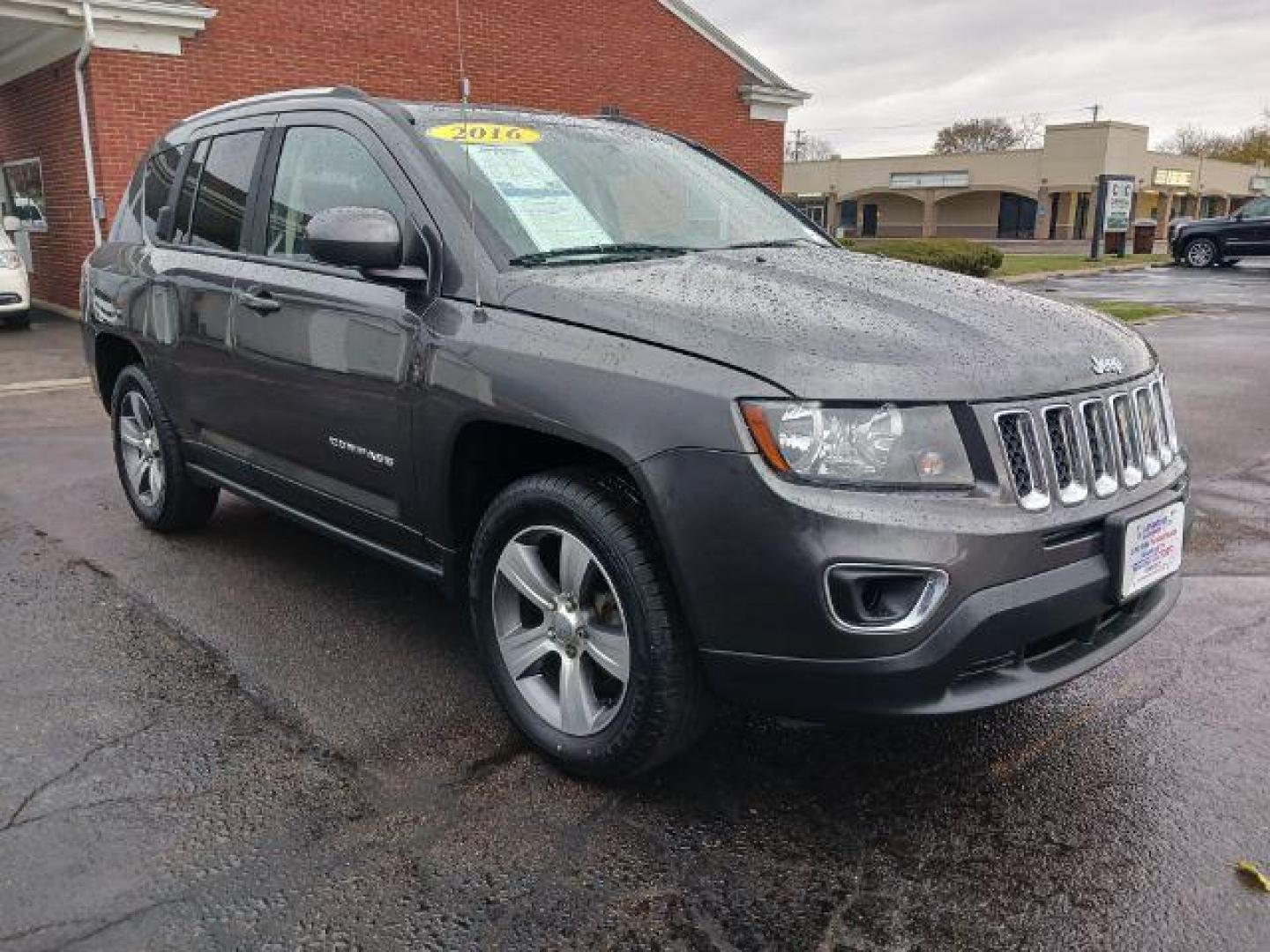 2016 Gray Jeep Compass Latitude 4WD (1C4NJDEB6GD) with an 2.4L L4 DOHC 16V engine, 6-Speed Automatic transmission, located at 880 E. National Road, Vandalia, OH, 45377, (937) 908-9800, 39.892189, -84.181015 - Photo#0