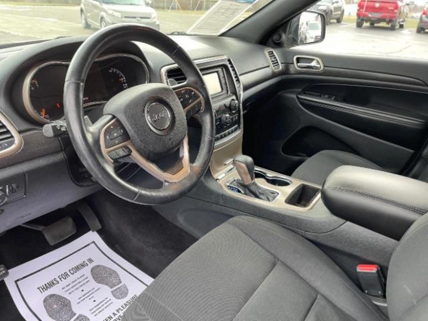 2016 Brilliant Black Crystal Pearl Coat Jeep Grand Cherokee Laredo 4WD (1C4RJFAG0GC) with an 3.6L V6 DOHC 24V engine, 8-Speed Automatic transmission, located at 1230 East Main St, Xenia, OH, 45385, (937) 908-9800, 39.687321, -83.910294 - Photo#6