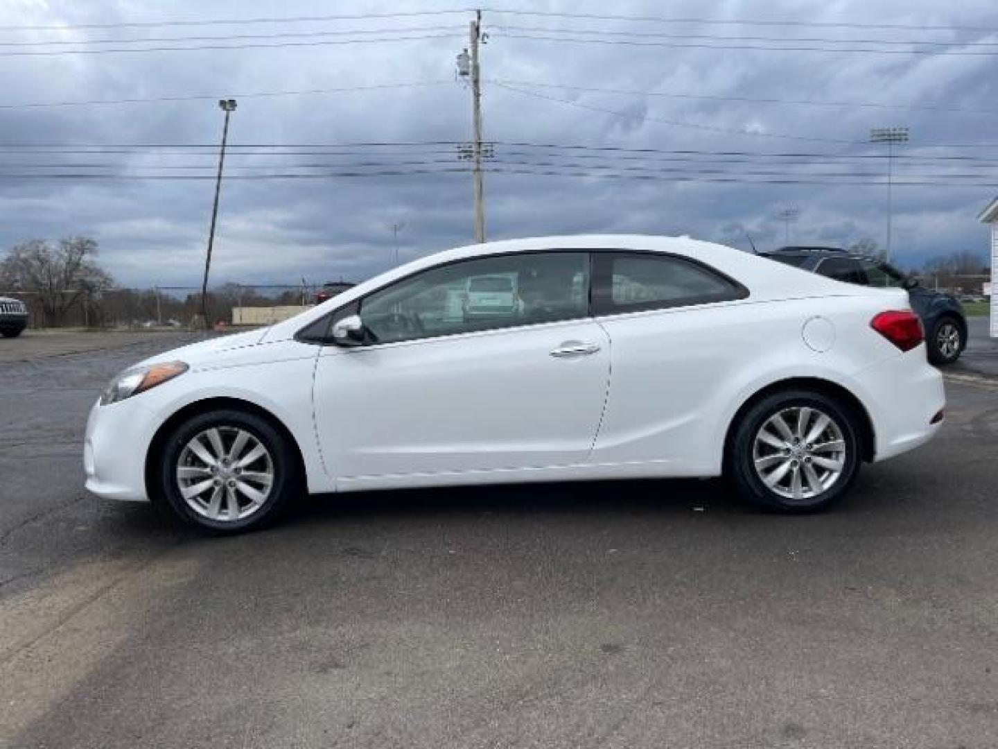 2016 Snow White Pearl Kia Forte Koup EX (KNAFX6A87G5) with an 2.0L L4 DOHC 16V engine, 6-Speed Automatic transmission, located at 880 E. National Road, Vandalia, OH, 45377, (937) 908-9800, 39.892189, -84.181015 - Photo#2