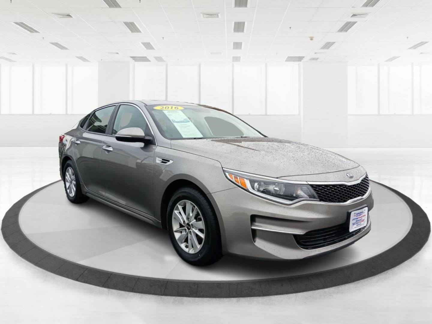 2016 Moss Grey Kia Optima LX (5XXGT4L34GG) with an 2.4L L4 DOHC 16V engine, 6-Speed Automatic transmission, located at 4508 South Dixie Dr, Moraine, OH, 45439, (937) 908-9800, 39.690136, -84.216438 - Photo#0