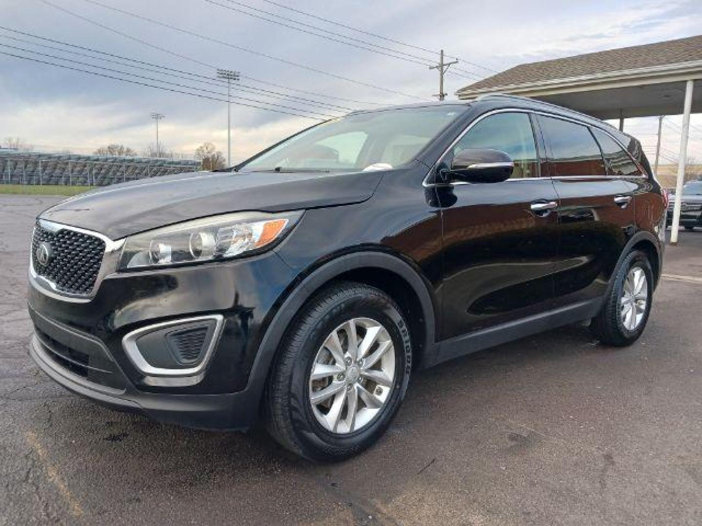 2016 Ebony Black Kia Sorento LX 2WD (5XYPG4A34GG) with an 2.4L L4 DOHC 16V engine, 6-Speed Automatic transmission, located at 4508 South Dixie Dr, Moraine, OH, 45439, (937) 908-9800, 39.690136, -84.216438 - Photo#2