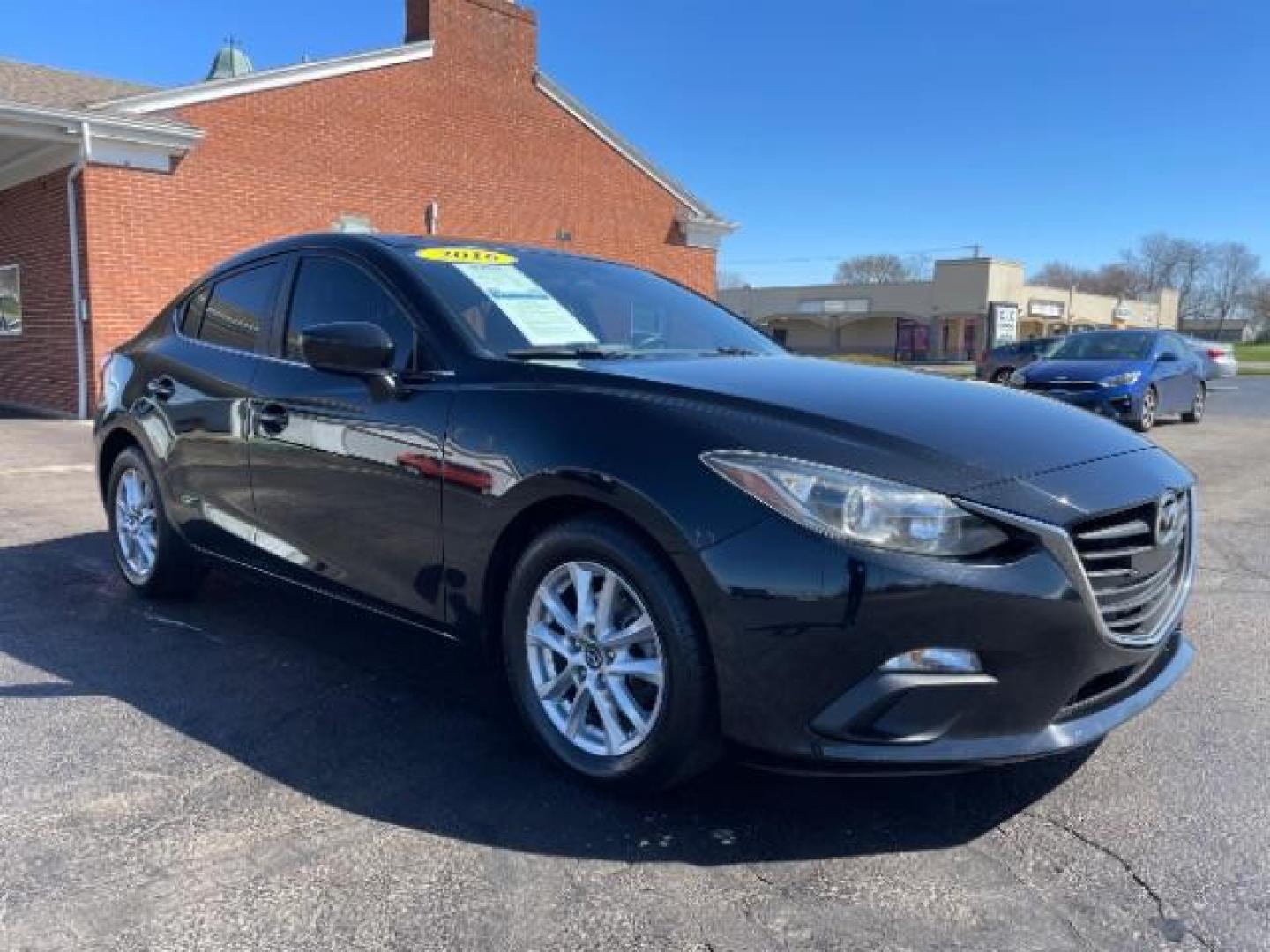 2016 Jet Black Mica Mazda MAZDA3 i Sport AT 4-Door (JM1BM1U73G1) with an 2.0L L4 DOHC 16V engine, 6-Speed Automatic transmission, located at 880 E. National Road, Vandalia, OH, 45377, (937) 908-9800, 39.892189, -84.181015 - Photo#0