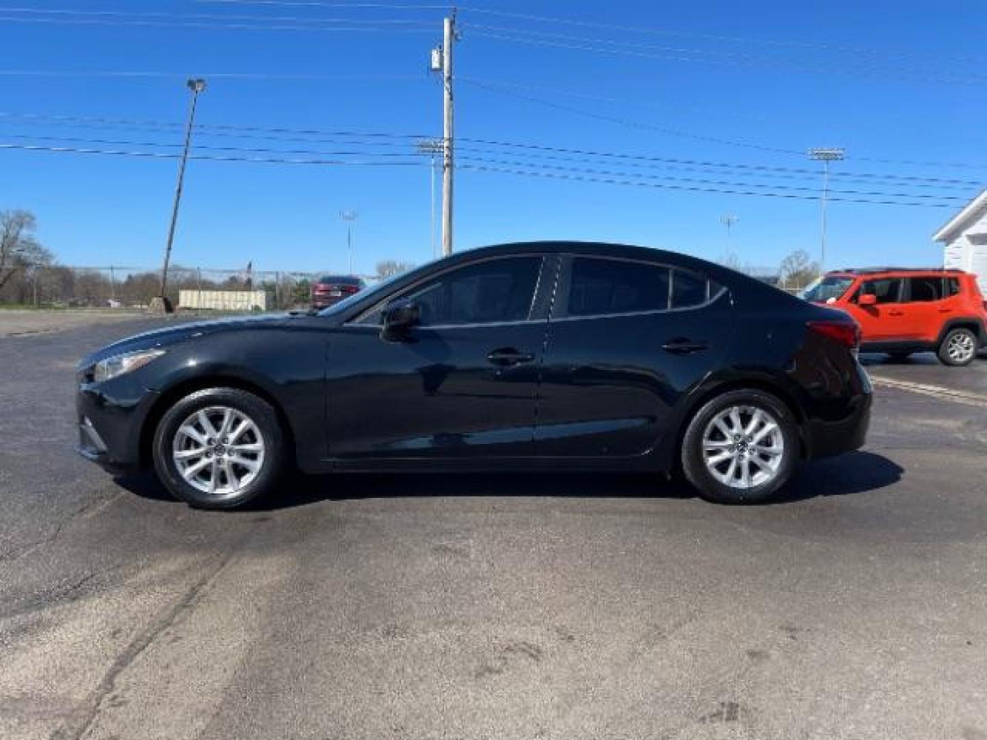 2016 Jet Black Mica Mazda MAZDA3 i Sport AT 4-Door (JM1BM1U73G1) with an 2.0L L4 DOHC 16V engine, 6-Speed Automatic transmission, located at 880 E. National Road, Vandalia, OH, 45377, (937) 908-9800, 39.892189, -84.181015 - Photo#2