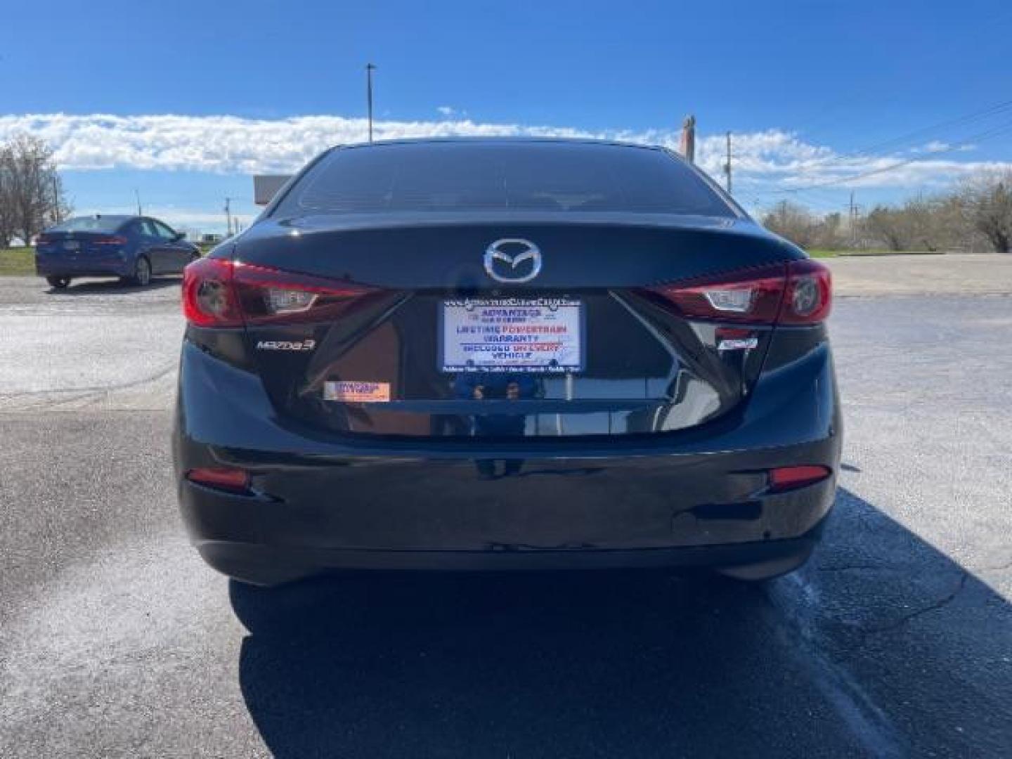 2016 Jet Black Mica Mazda MAZDA3 i Sport AT 4-Door (JM1BM1U73G1) with an 2.0L L4 DOHC 16V engine, 6-Speed Automatic transmission, located at 880 E. National Road, Vandalia, OH, 45377, (937) 908-9800, 39.892189, -84.181015 - Photo#4