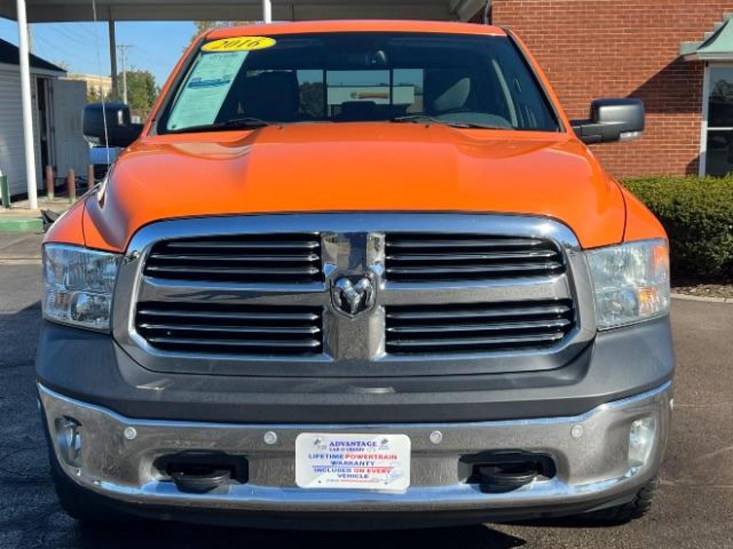 2016 Low Vol Omaha Orange RAM 1500 SLT Quad Cab 4WD (1C6RR7GT3GS) with an 5.7L V8 OHV 16V engine, 8-Speed Automatic transmission, located at 1184 Kauffman Ave, Fairborn, OH, 45324, (937) 908-9800, 39.807365, -84.029114 - Photo#1