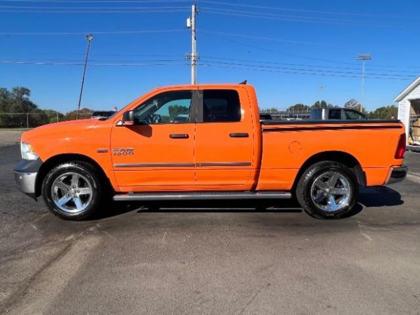 2016 Low Vol Omaha Orange RAM 1500 SLT Quad Cab 4WD (1C6RR7GT3GS) with an 5.7L V8 OHV 16V engine, 8-Speed Automatic transmission, located at 1184 Kauffman Ave, Fairborn, OH, 45324, (937) 908-9800, 39.807365, -84.029114 - Photo#3