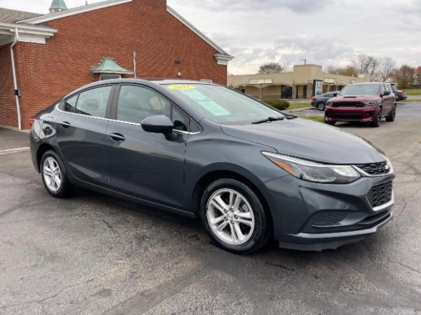 2017 Tungsten Metallic Chevrolet Cruze LT Auto (1G1BE5SM0H7) with an 1.4L L4 DOHC 16V TURBO engine, 6-Speed Automatic transmission, located at 1099 N County Rd 25A, OH, 45373, (937) 908-9800, 40.057079, -84.212883 - Photo#0