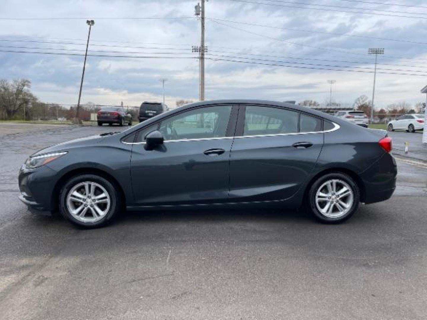 2017 Tungsten Metallic Chevrolet Cruze LT Auto (1G1BE5SM0H7) with an 1.4L L4 DOHC 16V TURBO engine, 6-Speed Automatic transmission, located at 1099 N County Rd 25A, OH, 45373, (937) 908-9800, 40.057079, -84.212883 - Photo#2