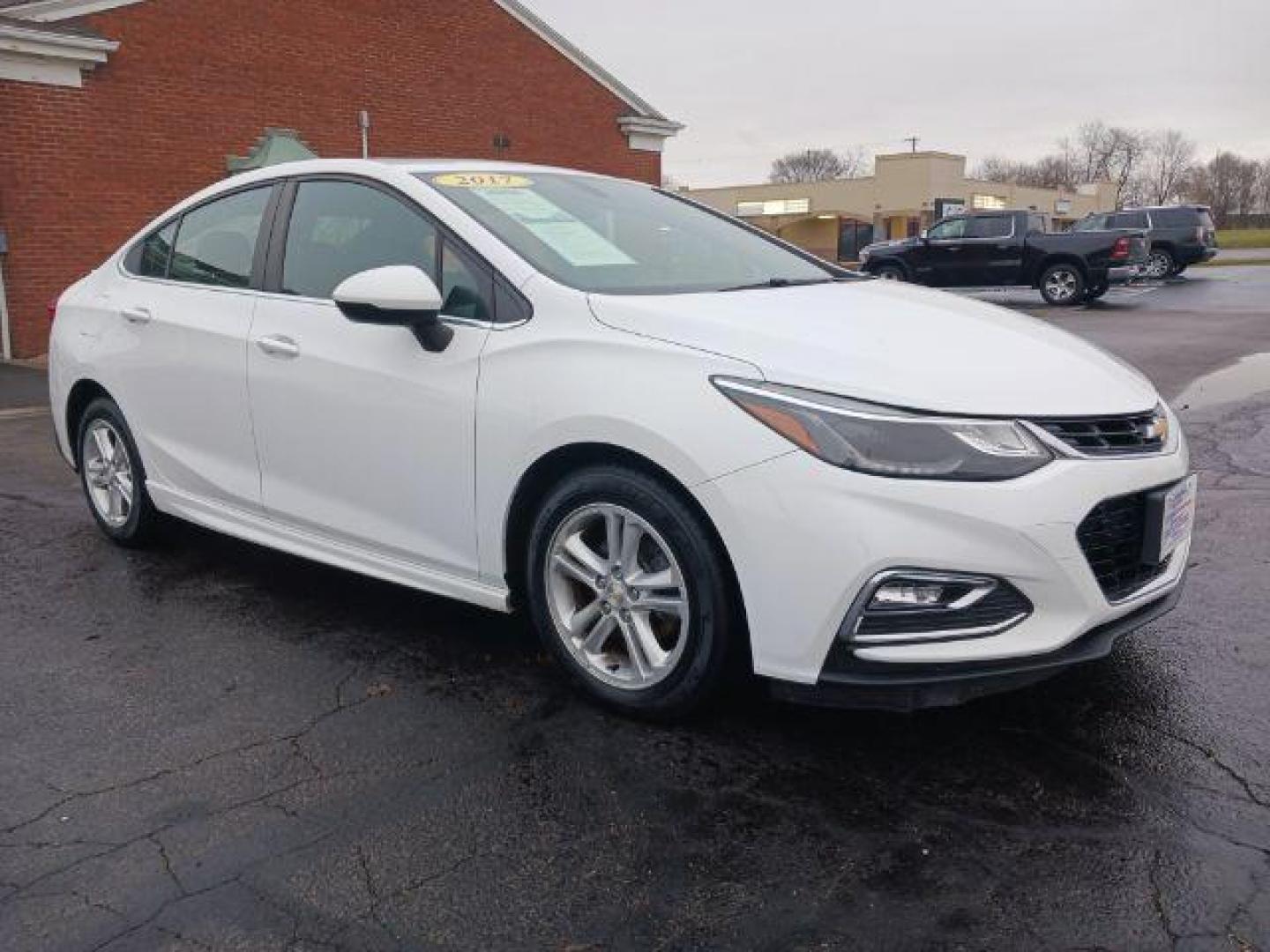 2017 Summit White Chevrolet Cruze LT Auto (1G1BE5SM9H7) with an 1.4L L4 DOHC 16V TURBO engine, 6-Speed Automatic transmission, located at 1099 N County Rd 25A, OH, 45373, (937) 908-9800, 40.057079, -84.212883 - Photo#0