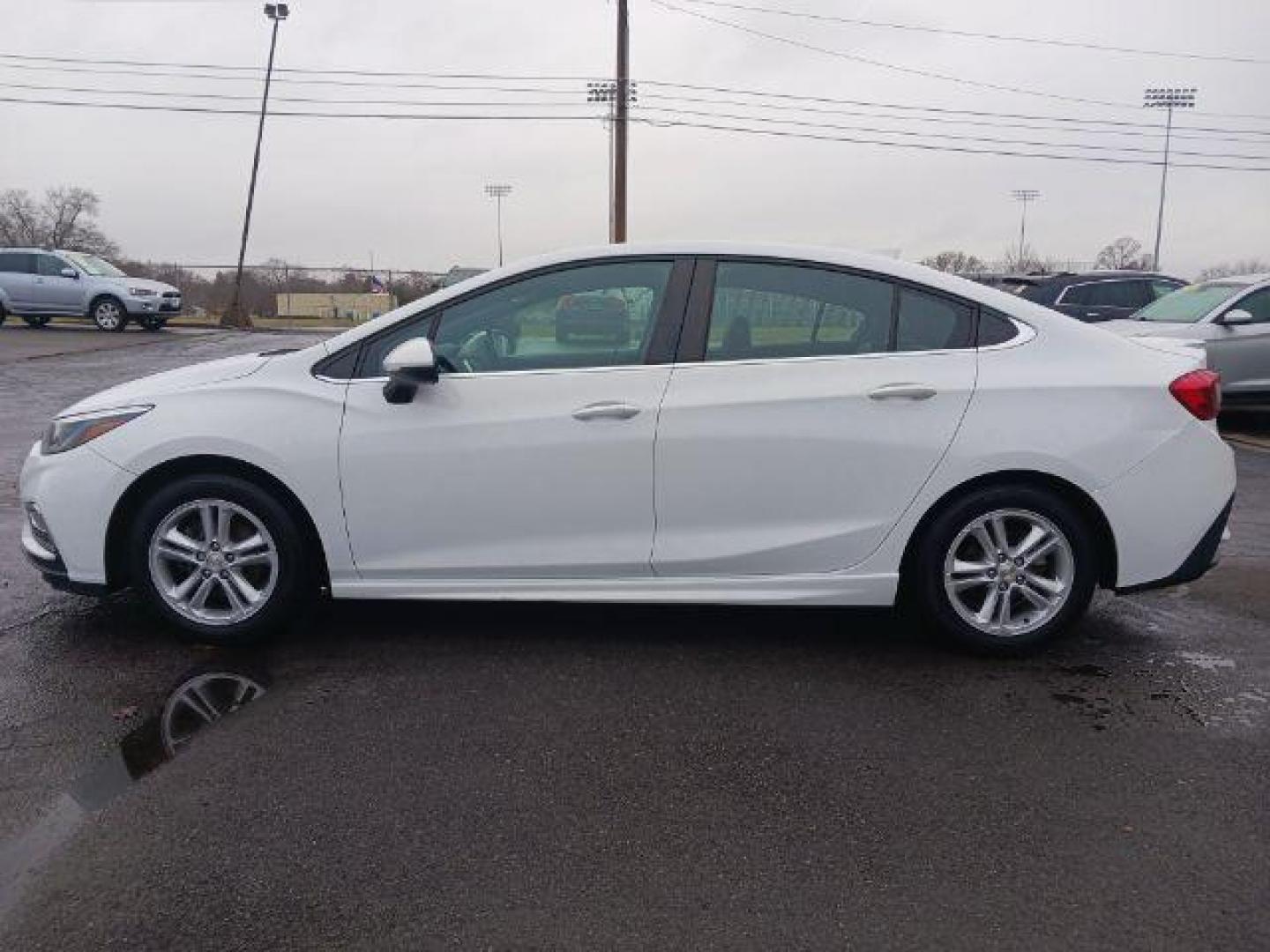 2017 Summit White Chevrolet Cruze LT Auto (1G1BE5SM9H7) with an 1.4L L4 DOHC 16V TURBO engine, 6-Speed Automatic transmission, located at 1099 N County Rd 25A, OH, 45373, (937) 908-9800, 40.057079, -84.212883 - Photo#3