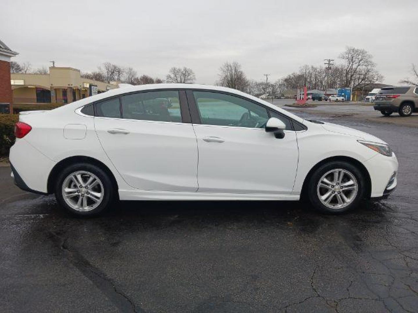 2017 Summit White Chevrolet Cruze LT Auto (1G1BE5SM9H7) with an 1.4L L4 DOHC 16V TURBO engine, 6-Speed Automatic transmission, located at 1099 N County Rd 25A, OH, 45373, (937) 908-9800, 40.057079, -84.212883 - Photo#4