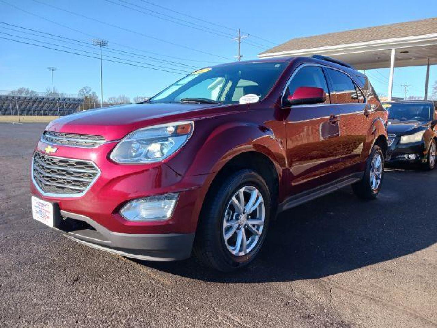 2017 Siren Red Tintcoat Chevrolet Equinox LT AWD (2GNFLFEKXH6) with an 2.4L L4 DOHC 16V FFV engine, 6-Speed Automatic transmission, located at 880 E. National Road, Vandalia, OH, 45377, (937) 908-9800, 39.892189, -84.181015 - Photo#2