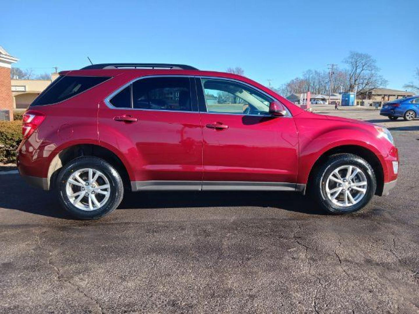 2017 Siren Red Tintcoat Chevrolet Equinox LT AWD (2GNFLFEKXH6) with an 2.4L L4 DOHC 16V FFV engine, 6-Speed Automatic transmission, located at 880 E. National Road, Vandalia, OH, 45377, (937) 908-9800, 39.892189, -84.181015 - Photo#4