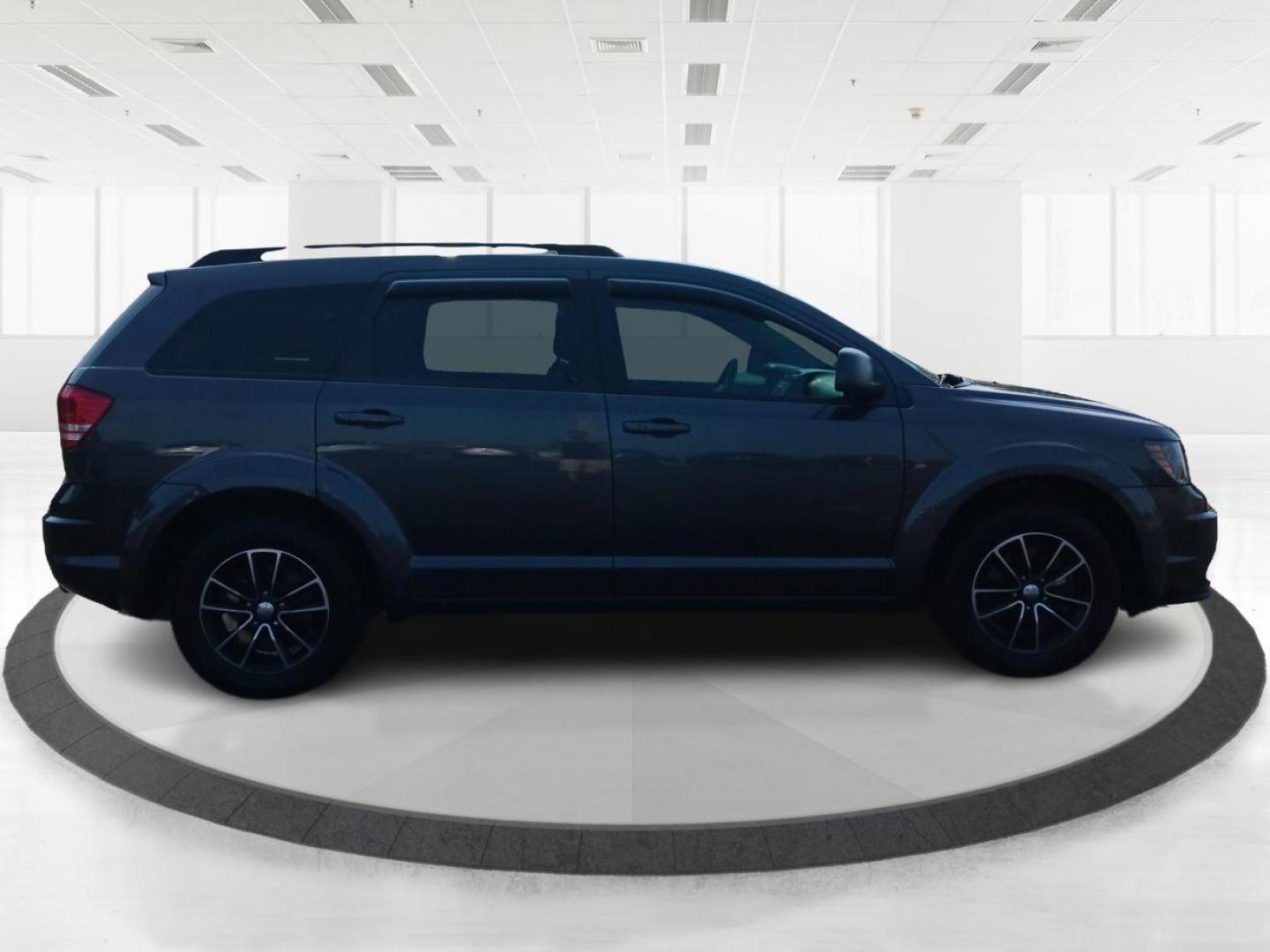 2017 Granite Metallic Clear Coat Dodge Journey SE (3C4PDCAB5HT) with an 2.4L L4 DOHC 16V engine, 4A transmission, located at 1951 S Dayton Lakeview Rd., New Carlisle, OH, 45344, (937) 908-9800, 39.890999, -84.050255 - Photo#0