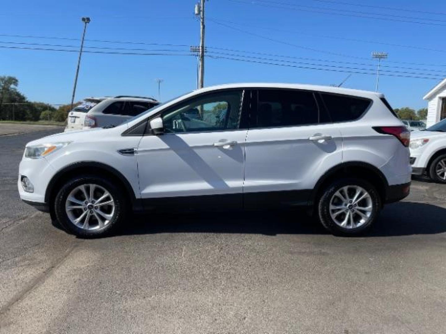 2017 White Platinum Tri-Coat Metallic Ford Escape SE FWD (1FMCU0GD1HU) with an 1.5L L4 DOHC 16V engine, 6-Speed Automatic transmission, located at 880 E. National Road, Vandalia, OH, 45377, (937) 908-9800, 39.892189, -84.181015 - Photo#2